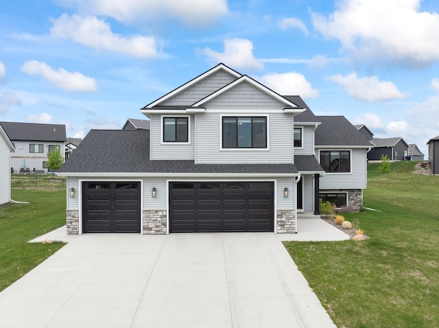1764 Brandt Dr NE, Byron, MN 55920 - view of front facade with stone siding, a front lawn, and driveway