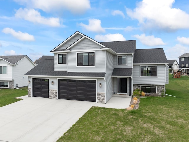 1764 Brandt Dr NE, Byron, MN 55920 - view of front of home featuring concrete driveway, a front lawn, roof with shingles, stone siding, and a garage