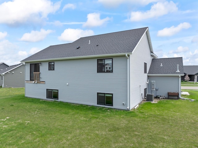 1764 Brandt Dr NE, Byron, MN 55920 - back of house with a yard, central air condition unit, and a shingled roof