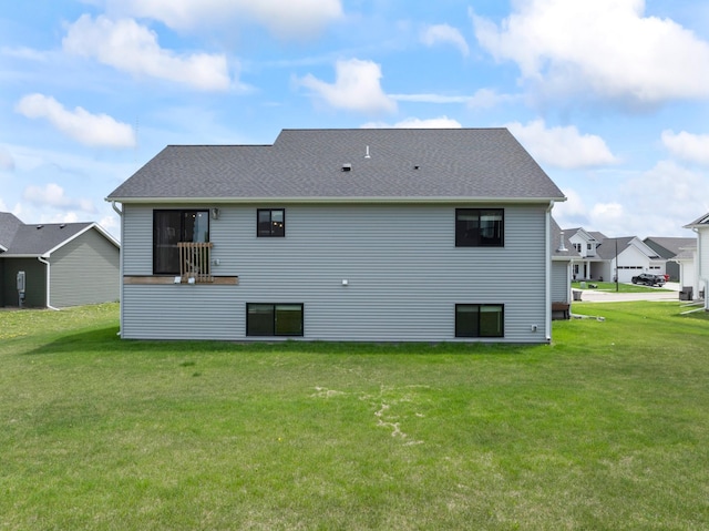 1764 Brandt Dr NE, Byron, MN 55920 - rear view of property featuring a yard and a shingled roof