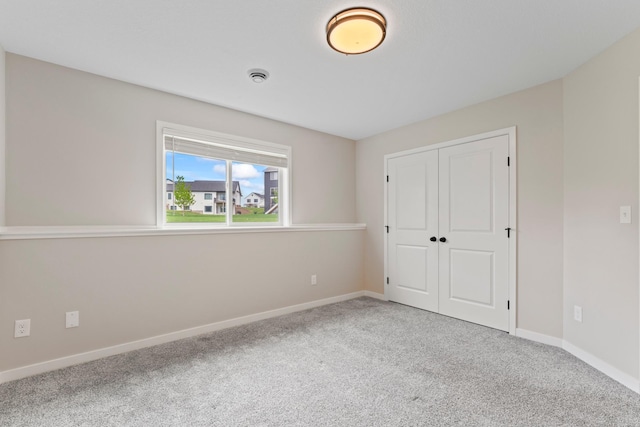 1764 Brandt Dr NE, Byron, MN 55920 - unfurnished bedroom with carpet flooring, a closet, and baseboards
