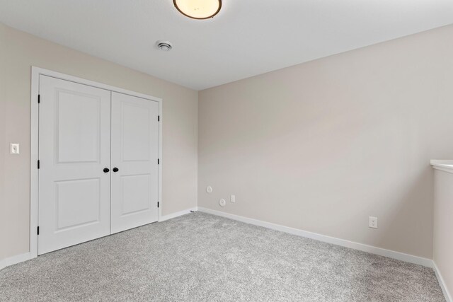 1764 Brandt Dr NE, Byron, MN 55920 - unfurnished bedroom with carpet flooring, baseboards, and a closet