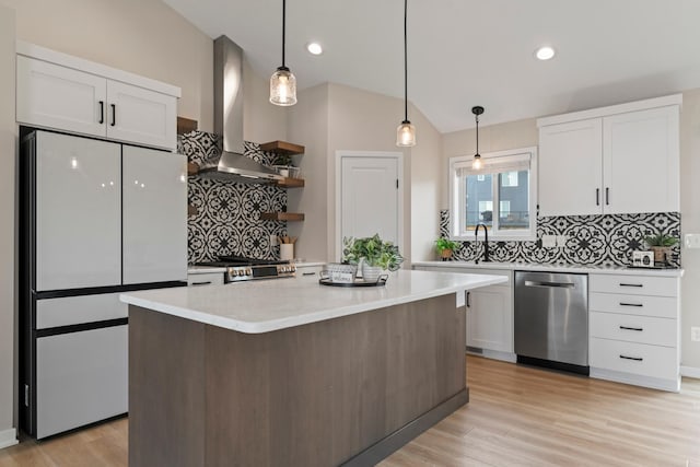 1764 Brandt Dr NE, Byron, MN 55920 - kitchen with wall chimney range hood, dishwasher, freestanding refrigerator, backsplash, and white cabinets