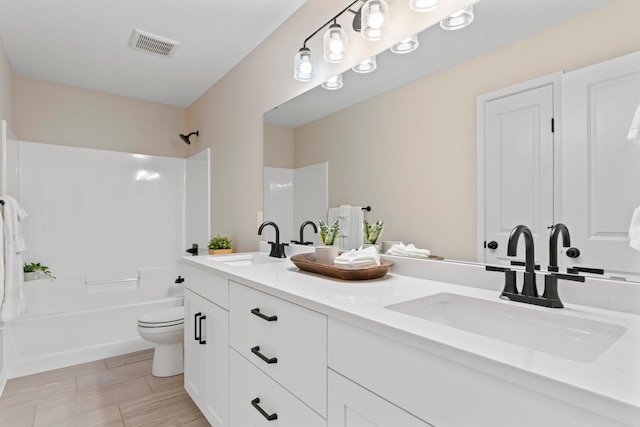 1764 Brandt Dr NE, Byron, MN 55920 - bathroom with  shower combination, toilet, and double vanity