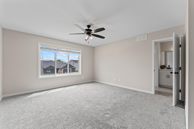 1764 Brandt Dr NE, Byron, MN 55920 - empty room featuring carpet floors, ceiling fan, and baseboards
