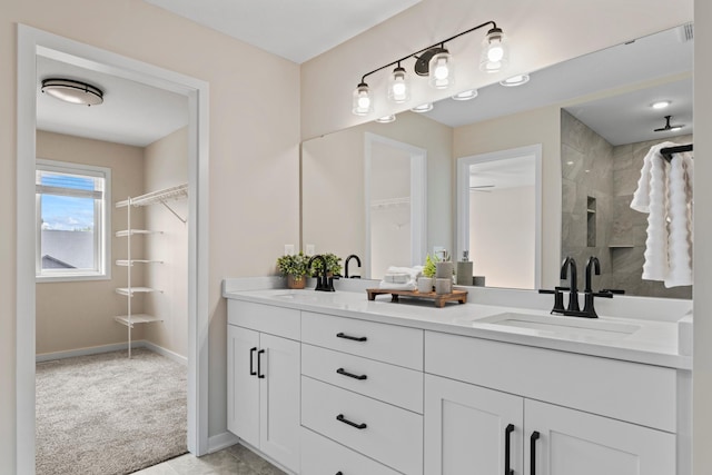 1764 Brandt Dr NE, Byron, MN 55920 - full bathroom featuring double vanity, a tile shower, and baseboards