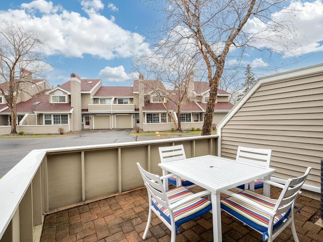 view of patio / terrace with a residential view and outdoor dining space