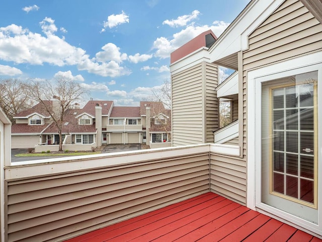 wooden terrace with a residential view