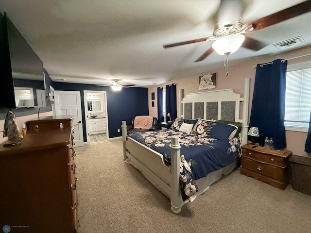 436 2nd Ave E, Halstad, MN 56548 - carpeted bedroom featuring ceiling fan and ensuite bathroom