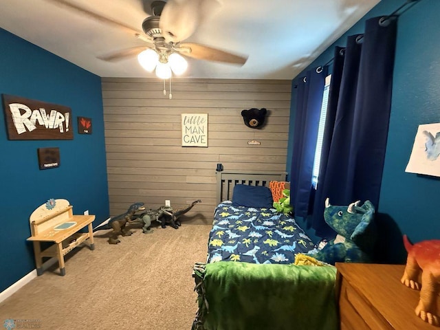 436 2nd Ave E, Halstad, MN 56548 - bedroom with carpet, wooden walls, and ceiling fan