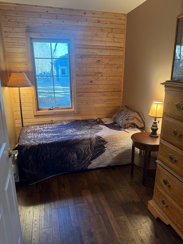 bedroom with dark wood-type flooring