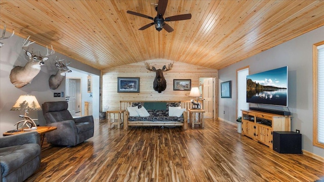 living area with wood ceiling, baseboards, wood finished floors, and wooden walls