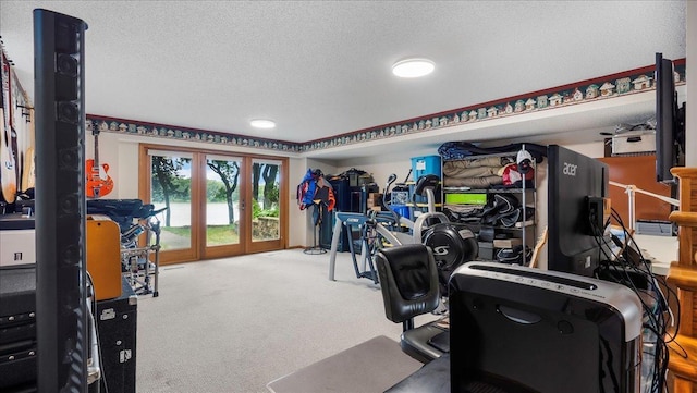 rec room with carpet flooring and a textured ceiling