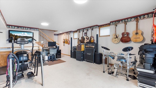 interior space with carpet and baseboards