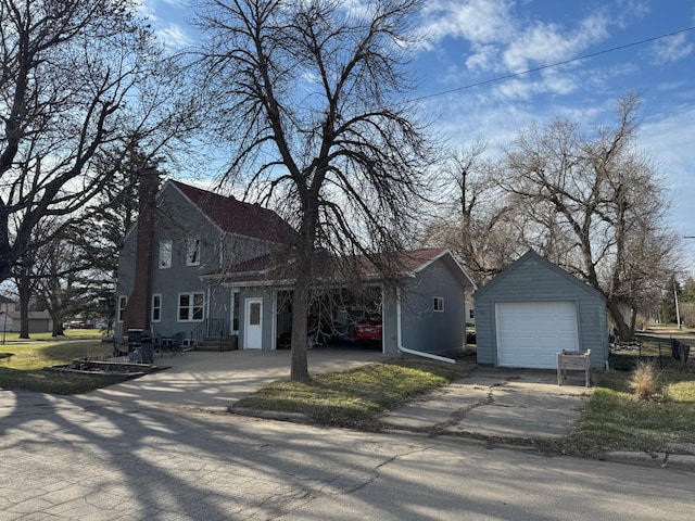 201 2nd St W, Chokio, MN 56221 - traditional-style house with driveway, an outbuilding, a chimney, and a garage