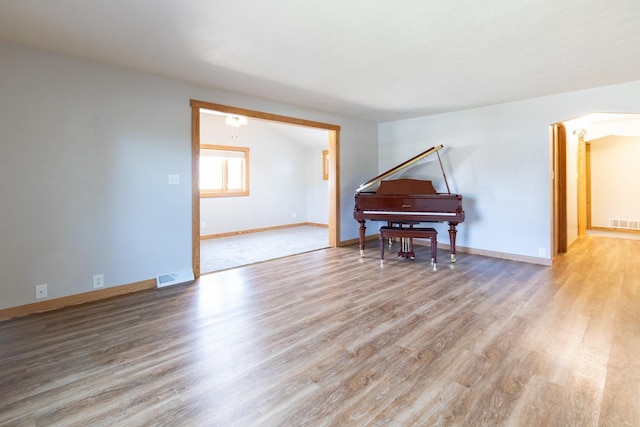 sitting room featuring wood finished floors and baseboards
