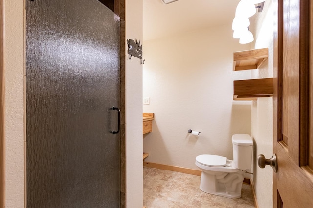full bath featuring a shower stall, toilet, and baseboards