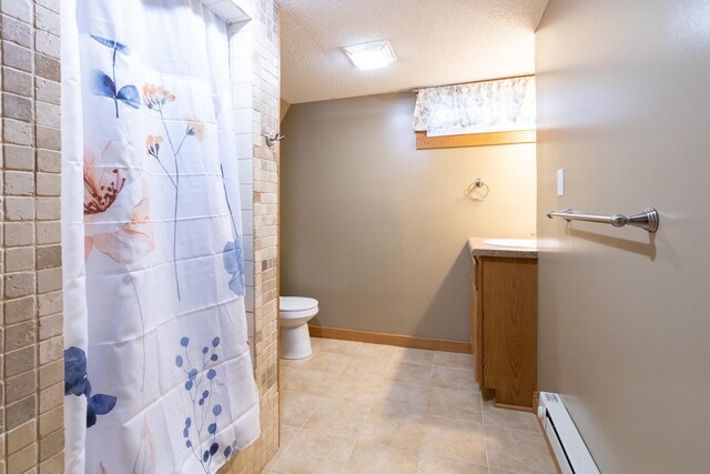 full bath featuring a baseboard radiator, a textured ceiling, tile patterned floors, toilet, and vanity