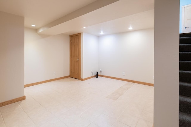 finished basement featuring recessed lighting, stairway, and baseboards