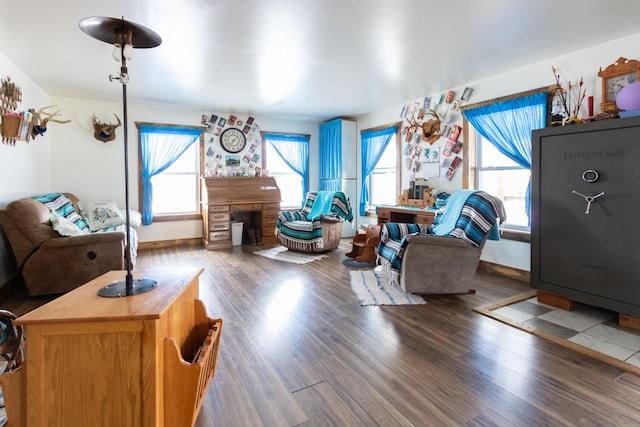 living area with wood finished floors and baseboards
