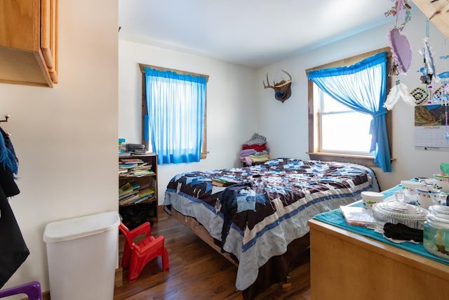 bedroom with wood finished floors