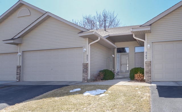 view of front of property featuring an attached garage and driveway