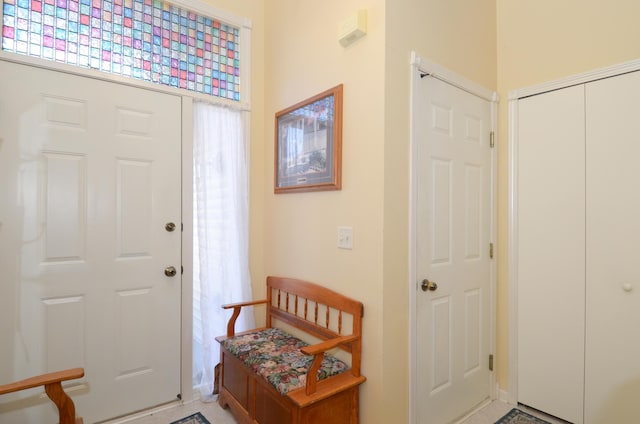 foyer featuring baseboards