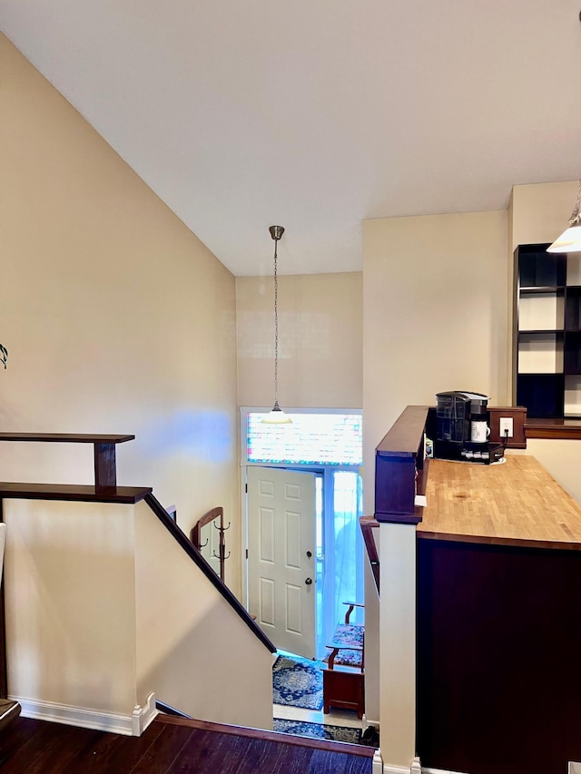 entrance foyer featuring dark wood-type flooring and baseboards
