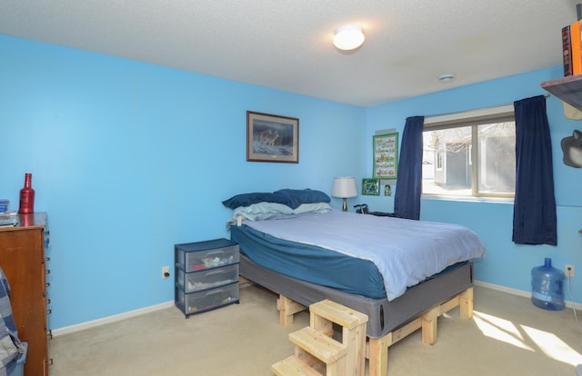 bedroom with carpet and baseboards