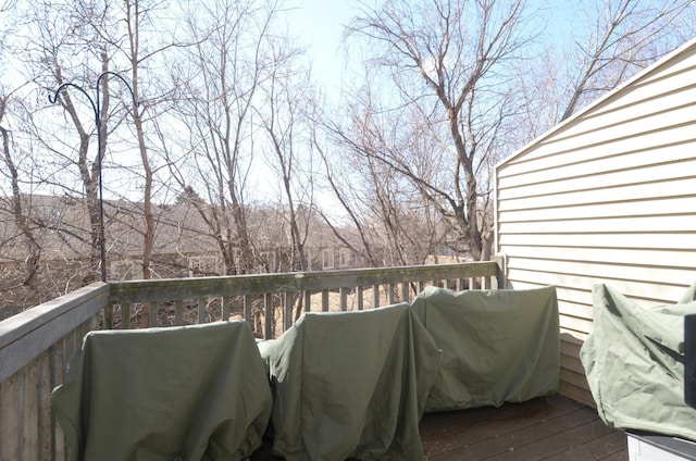 wooden terrace featuring a grill