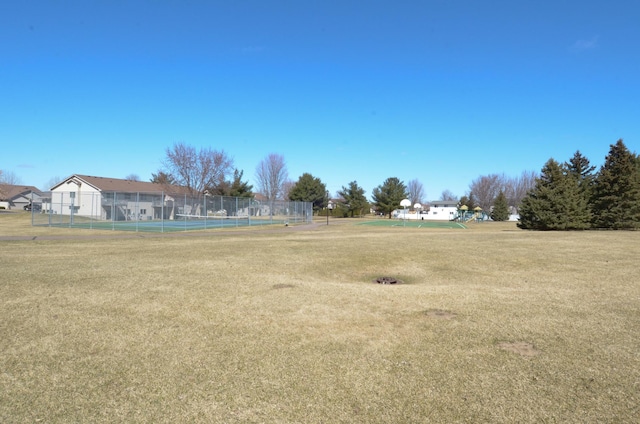 view of yard featuring a tennis court