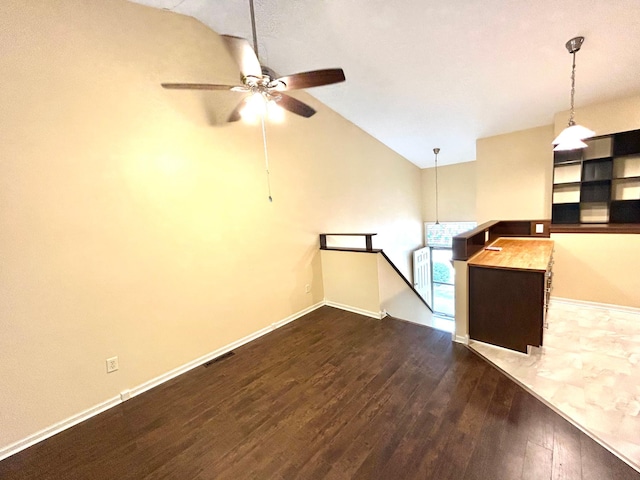 953 14th Ln SE, Cambridge, MN 55008 - unfurnished living room featuring dark wood finished floors, ceiling fan, and high vaulted ceiling