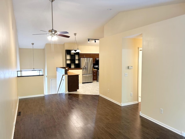 953 14th Ln SE, Cambridge, MN 55008 - unfurnished living room with ceiling fan, vaulted ceiling, wood finished floors, and rail lighting