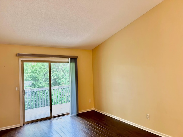 953 14th Ln SE, Cambridge, MN 55008 - empty room featuring dark wood-type flooring and a textured ceiling