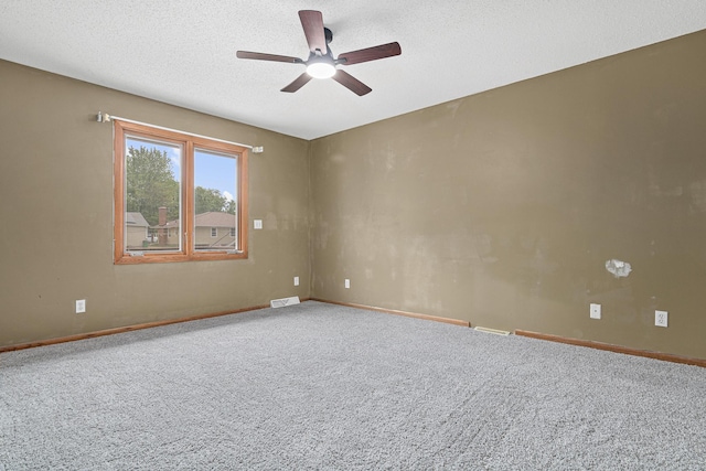 4418 Chowen Ave N, Robbinsdale, MN 55422 - carpeted empty room featuring ceiling fan, baseboards, and a textured ceiling