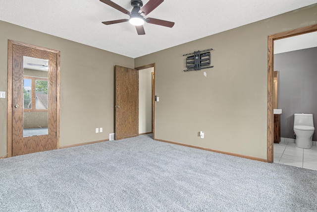 4418 Chowen Ave N, Robbinsdale, MN 55422 - unfurnished bedroom featuring light carpet, baseboards, ensuite bath, and ceiling fan