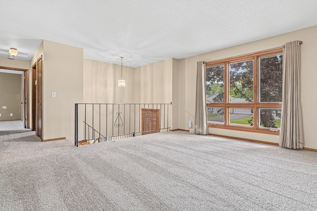 4418 Chowen Ave N, Robbinsdale, MN 55422 - spare room with carpet flooring and a textured ceiling