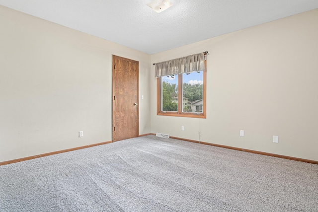 4418 Chowen Ave N, Robbinsdale, MN 55422 - spare room featuring carpet and a textured ceiling