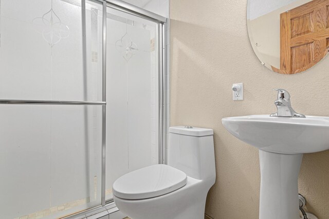 4418 Chowen Ave N, Robbinsdale, MN 55422 - bathroom with a shower stall and a textured wall