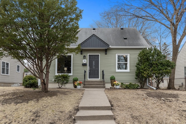 view of front of property featuring roof with shingles