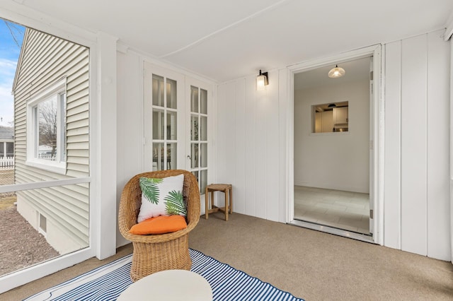living area with french doors and carpet floors