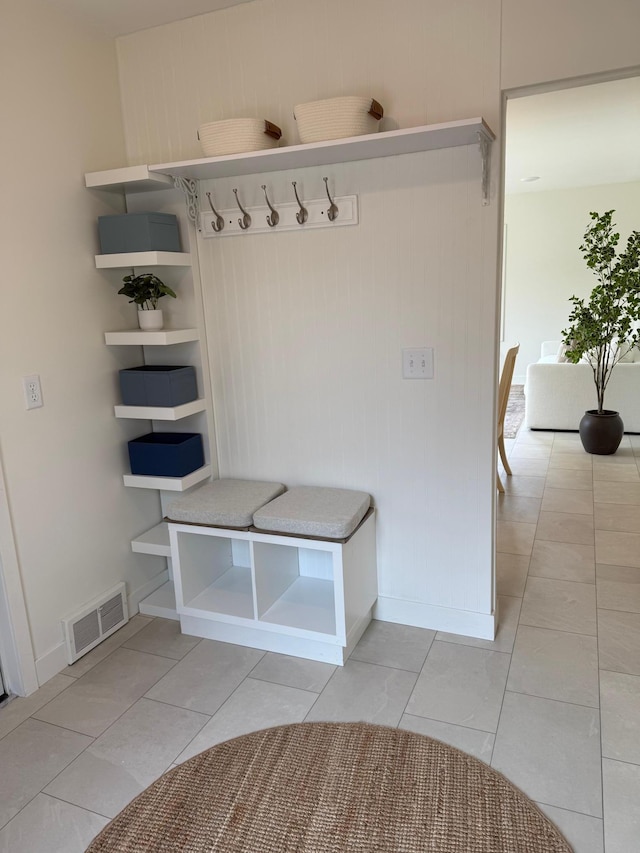 mudroom featuring light tile patterned floors and visible vents