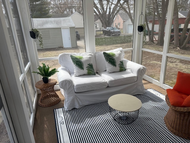 sunroom / solarium featuring an outdoor hangout area
