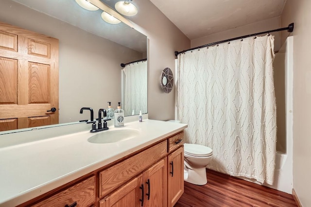 full bath with wood finished floors, toilet, vanity, and shower / bathtub combination with curtain