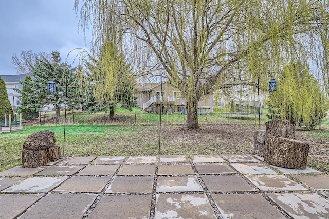 view of patio / terrace featuring fence