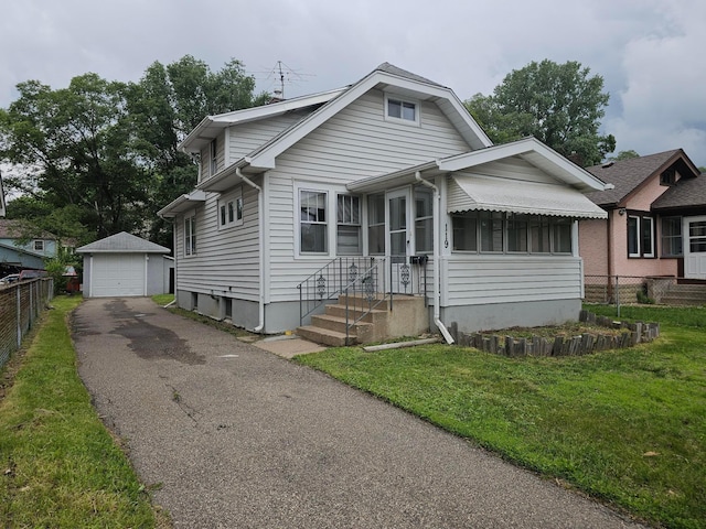 119 10th Ave N, South Saint Paul, MN 55075 - bungalow-style home with driveway, a detached garage, and an outdoor structure