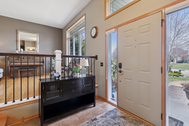 tiled entryway with baseboards