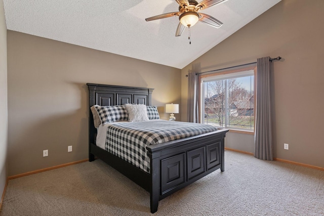 bedroom featuring ceiling fan, vaulted ceiling, baseboards, and light carpet