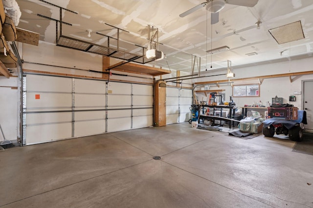 garage featuring ceiling fan and a garage door opener