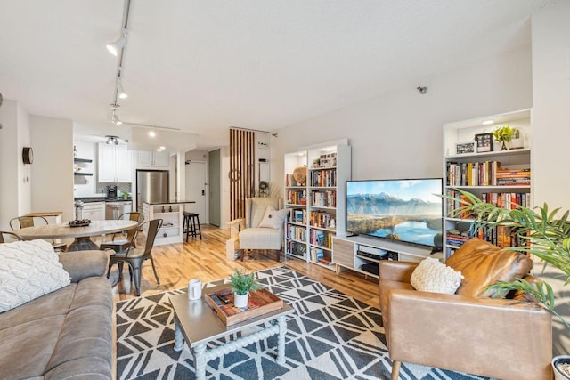 401 1st St Unit 308, Minneapolis, MN 55401 - living room with rail lighting and light wood-style floors